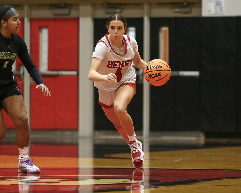 Benet's Ava Mersinger (4) dribbles past halfcourt during their Class 4A Bolingbrook Sectional final basketball game between Waubonsie Valley at Benet. Feb 27, 2025 in Bolingbrook.