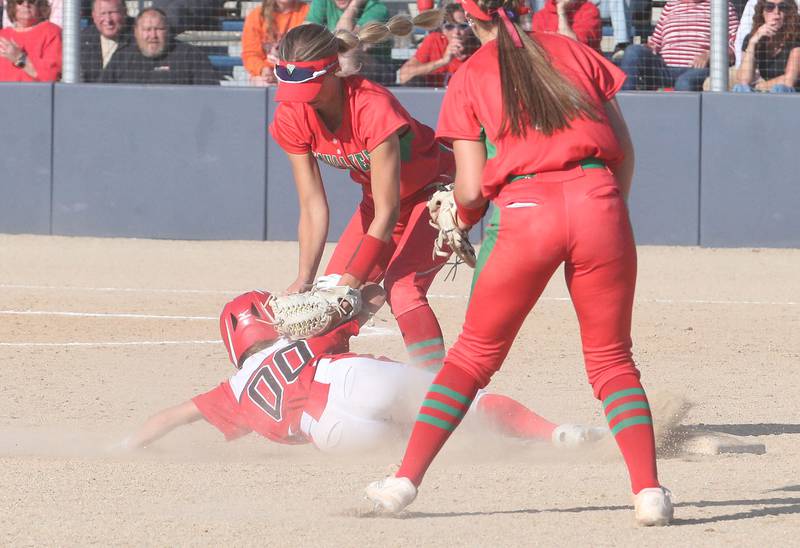 Streator's Kieran Black slides under the tag from L-P's Kelsey Frederick during the Class 3A Regional semifinal game on Tuesday, May 27, 2025 at Pontiac High School.