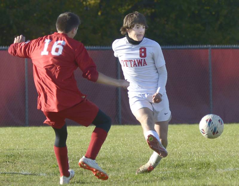 Ottawa’s Mason Jangle gets a pass by Streator’s Landon Muhlstadt in the 1st half Tuesday at Streator.