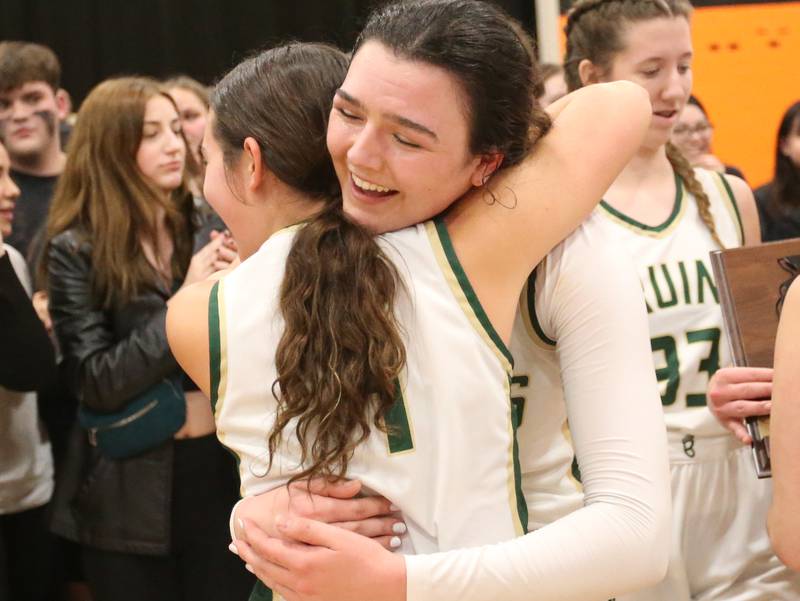 St. Bede's Ali Bosnich hugs teammate Bailey Engles after defeating Serena in the Class 1A Sectional final game on Thursday, Feb. 22, 2024 at Gardner-South Wilmington High School.