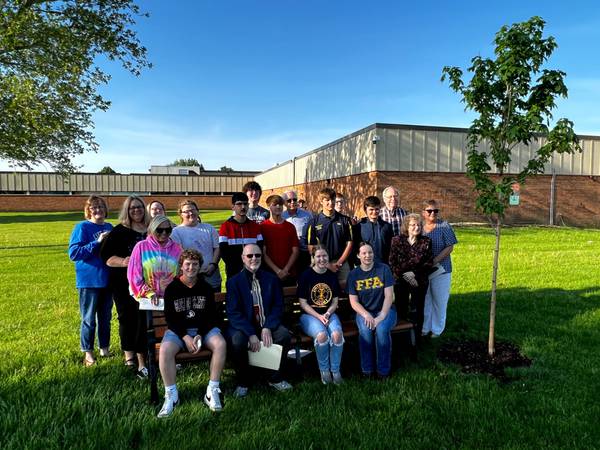 Putnam County Interact Club and FFA dedicate tree and bench to former technology director
