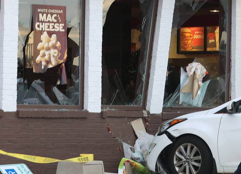 A view of broken windows after a car stuck the Arby's building on Friday, Dec. 19, 2025 in Peru. The incident happened shortly after 3:30p.m. No injuries were reported.
