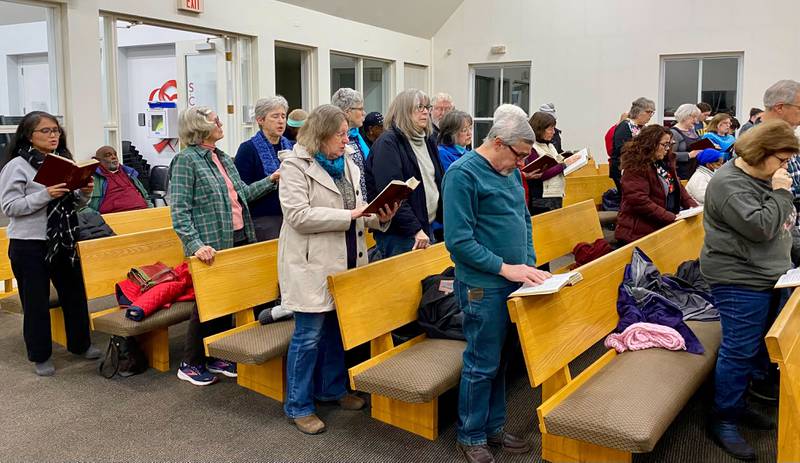 Crowd members sing the hymn "Lift Every Voice and Sing," during the annual Martin Luther King, Jr., Celebration on Monday, Jan. 20, 2025, at New Hope Missionary Baptist Church, 1201 Twombly Road, DeKalb.