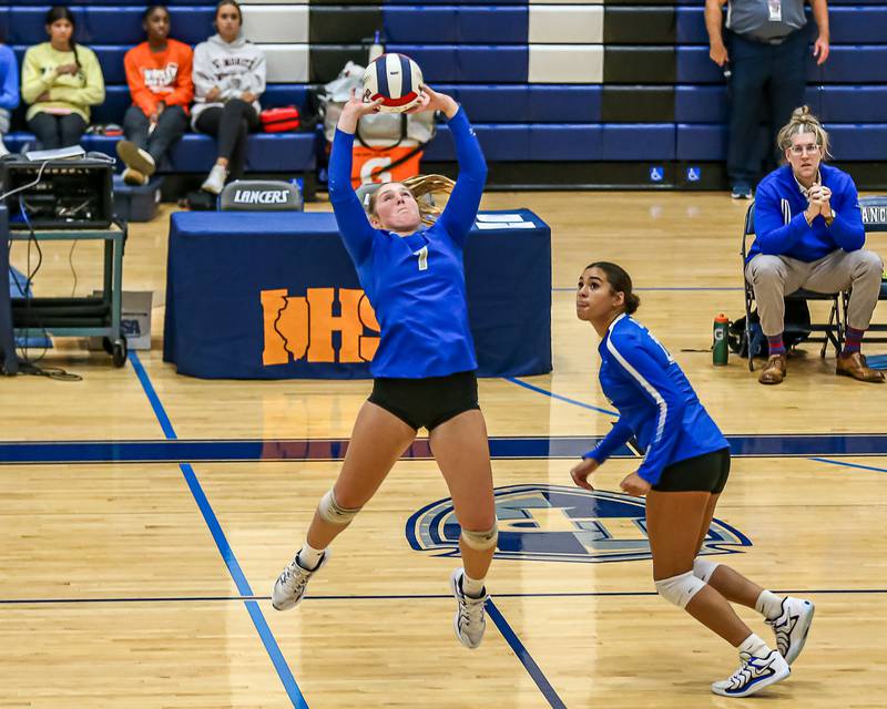 St. Charles North's Mia Mccall (7) sets a shot during Class 4A Lake Park Regional final volleyball match between Wheaton North at St Charles North.  Oct 31, 2024  in Roselle.