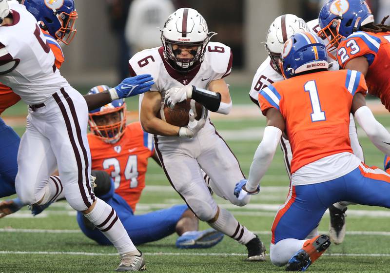 Prairie Ridge's Luke Vanderwiel tries to get by East St. Louis' Leontre Bradford during their IHSA Class 6A state championship game Saturday, Nov. 26, 2022, in Memorial Stadium at the University of Illinois in Champaign.