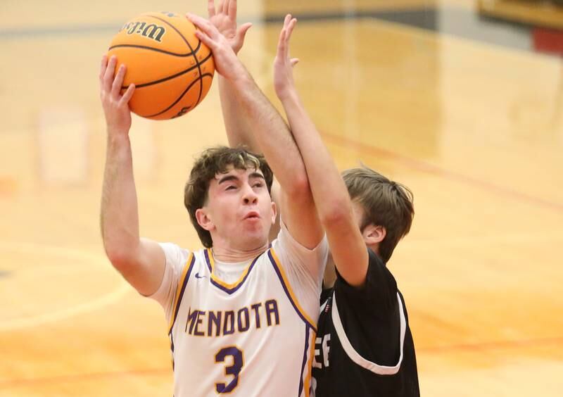 Mendota's Cam Kelly eyes the hoop while playing Kewanee during the 50th annual Colmone Classic on Thursday, Dec. 12, 2024 at Hall High School.