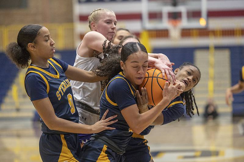 Sterling and Hononegah players battle for the ball Saturday, Dec. 21, 2024, during the Sterling Shootout.