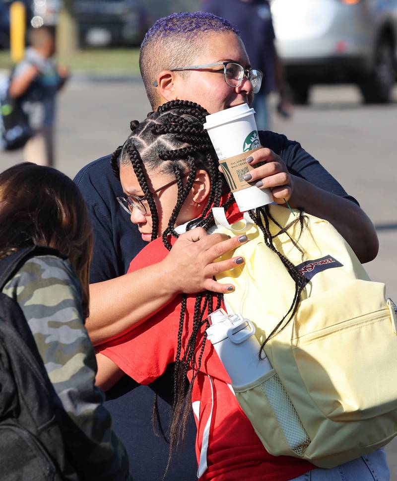 Fifth-grader Tianna Shaw hugs her mom Carolina Wallace as they arrive Wednesday, Aug. 17, 2022, on the first day of school at North Elementary in Sycamore.