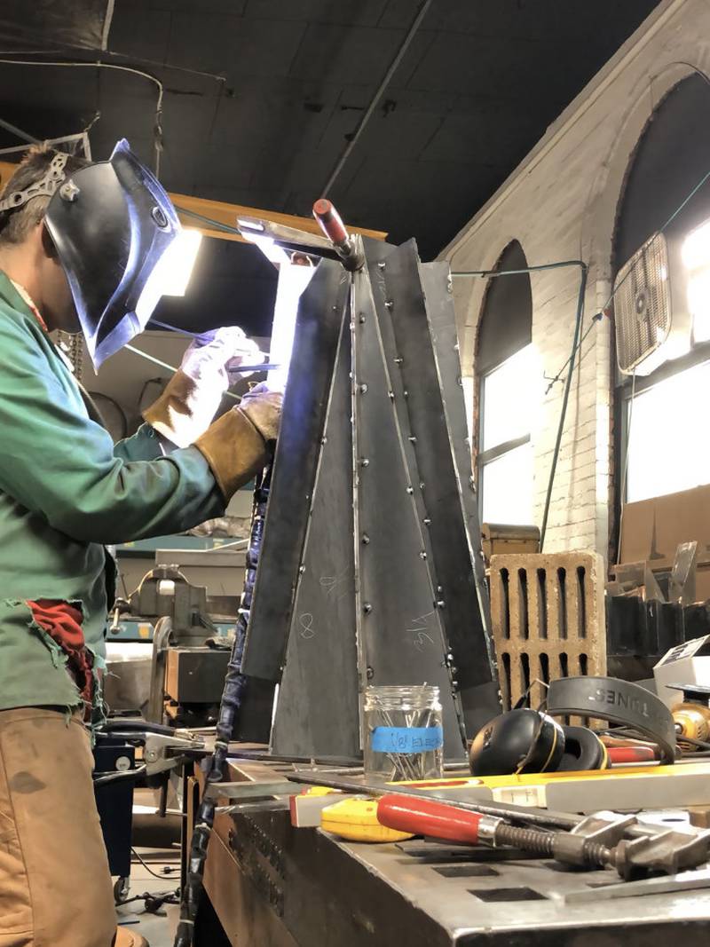 Artist Joshua Enck works on Hortus in his New York studio. When completed, the 14-foot steel sculpture will be  installed at the Geneva Public Library as public art in the Memorial Garden. The Dudley D. and Delores R. Malone Family Foundation provided the funding for the garden and the art.