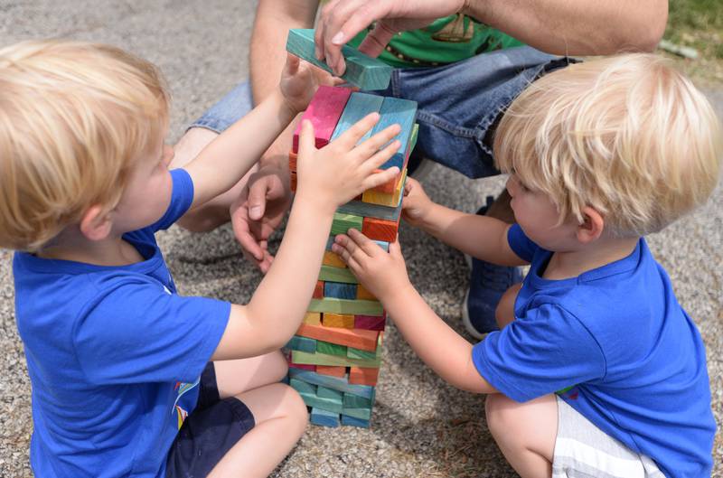 (left) Orion and Apollo Stehlikbarry-Gjondla of Brookfield play with blocks during the family picnic held after the Berwyn Pride Parade Saturday June 15, 2024.