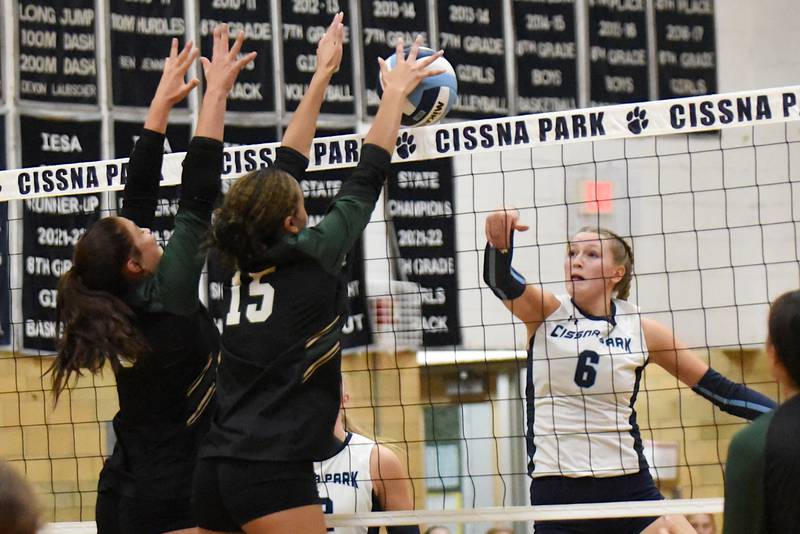 Cissna Park's Marina Day, right, watches her hit get blocked by Bishop McNamara's Jersey Slone (15) during a game at Cissna Park Wednesday, Oct. 15, 2025.