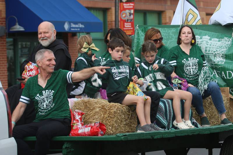 St. Bede administration ride in a float during the St. Bede Homecoming parade on Friday, Sept. 27, 2024 downtown Peru.