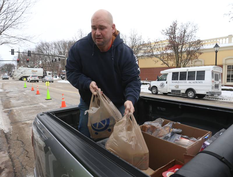 Ryan Nelle Traffic Manager at Infra-Metals in Marseilles, donates boxes of food during the 17th annual Freezin’ for a Reezin’ event on Friday, Dec. 5, 2025 outside of the WCMY studios downtown Ottawa. Donations support the Community Food Basket of Ottawa.