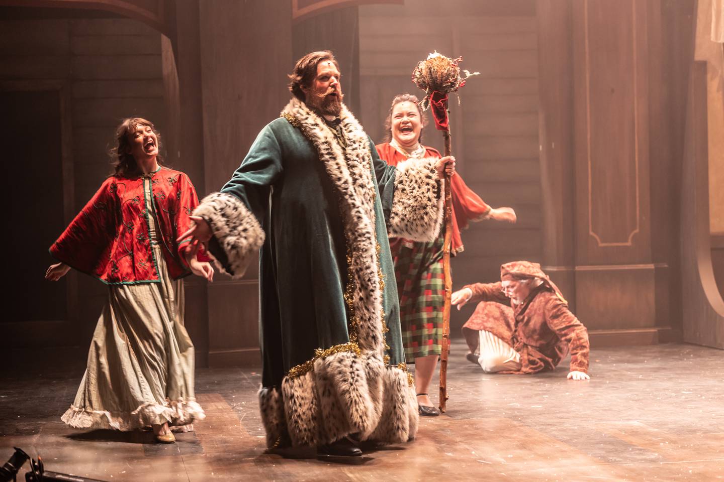 Scrooge (Stephen Connell of Crystal Lake) encounters the ghost of Christmas Present (Jim LaPietra) in "A Christmas Carol" at the Metropolis Performing Arts Centre in Arlington Heights through Dec. 23, 2024.