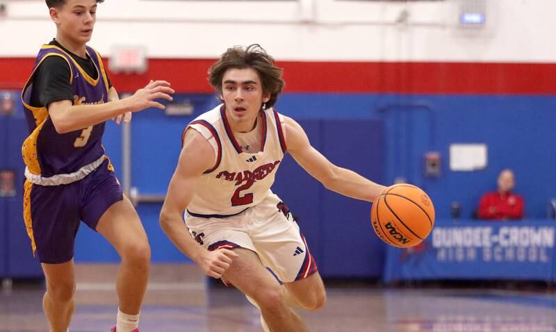 Dundee-Crown’s Jared Russell moves the ball against Wauconda in varsity basketball Friday, Dec. 20, 2024 at Dundee-Crown High School in Carpentersville.