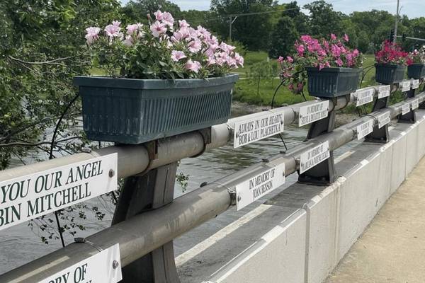 Honor a loved one with sign on Montgomery bridge