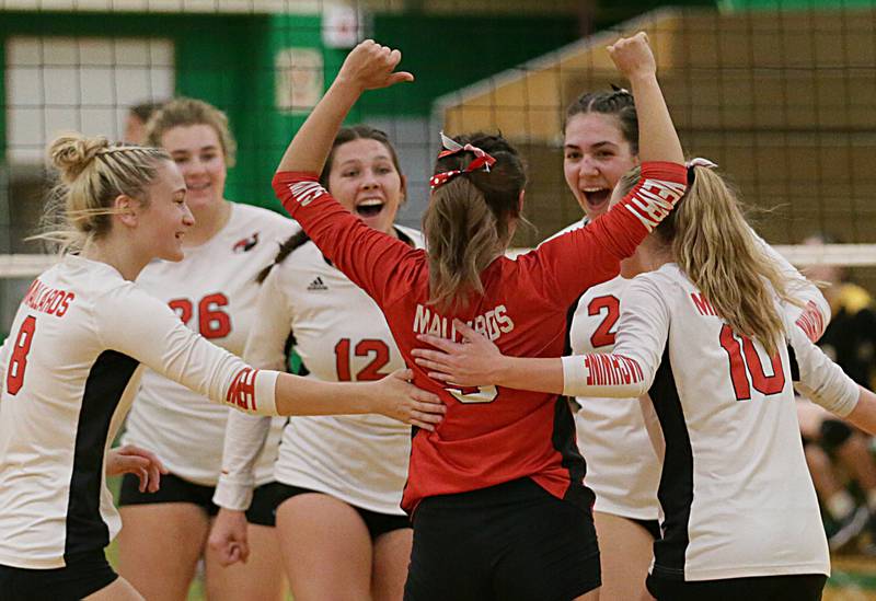 Members of the Henry-Senachwine volleyball team celebrate after scoring a point against Putnam County in the Tri-County Conference Tournament on Monday, Oct. 10, 2022 in Seneca.
