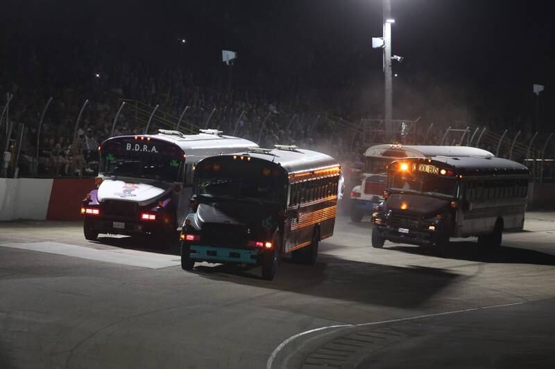 School buses compete on a special fundraising night for the Special Olympics at Grundy County Speedway on June 15, 2024 in Morris.