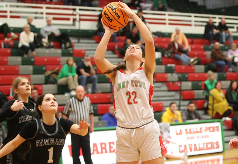 L-P's Brianna Ruppert eyes the hoop while running in the lane past Kaneland's Daniela Ridolfi on Wednesday, Jan. 15, 2025 in Sellett Gymnasium at L-P High School.