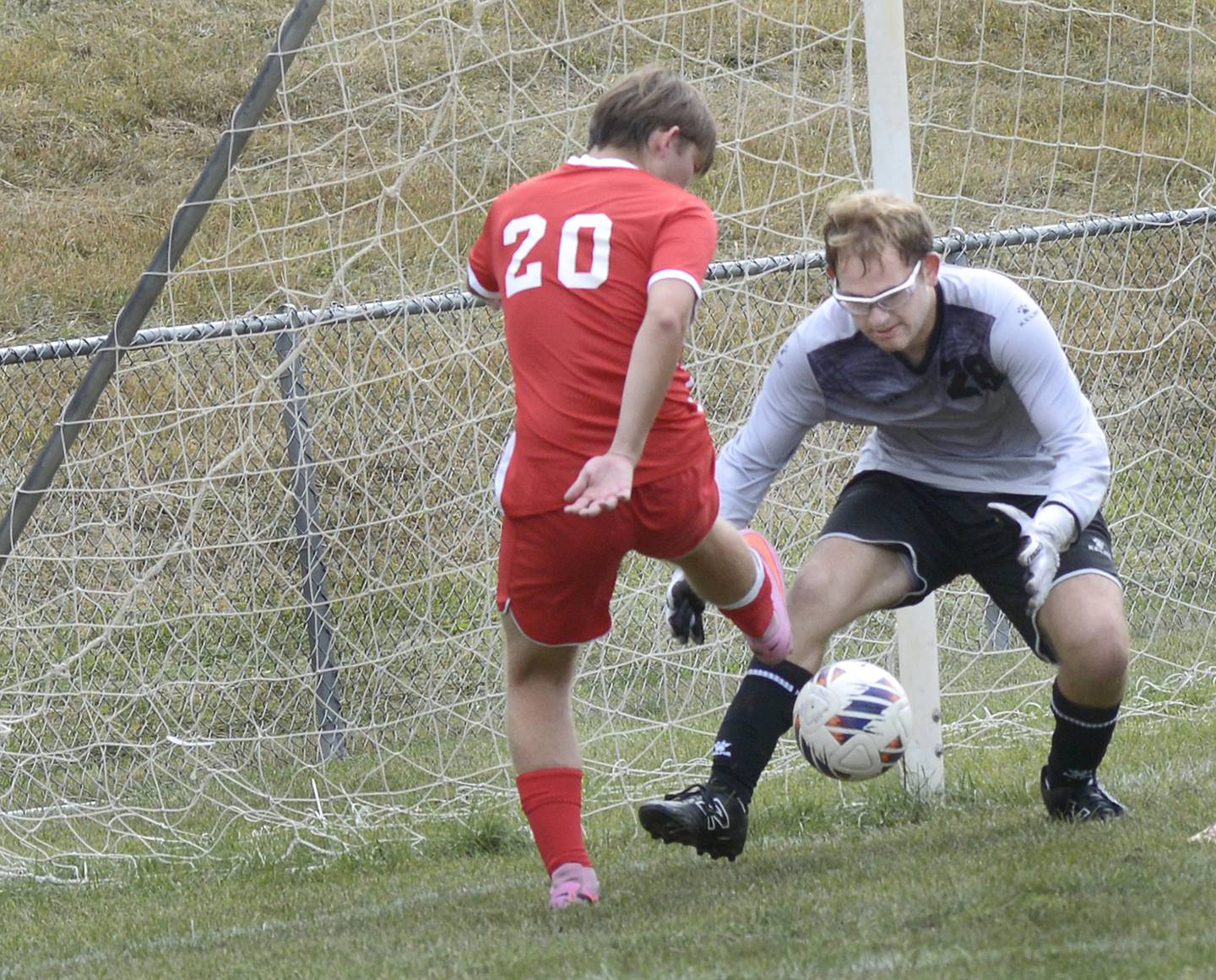 Ottawa’s Jacob Phelps comes in to help team mate goalie Landry Brenbarger make a stop in the 1st half of Saturday’s match against Streator at Ottawa.