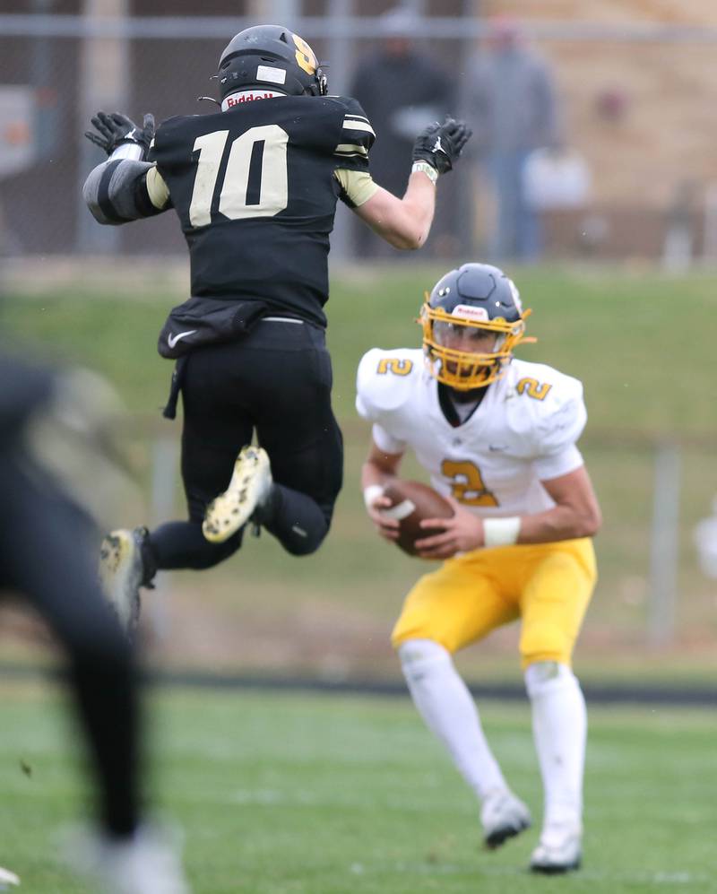 Sycamore's Zack Crawford leaps at Sterling's JP Schilling during their Class 5A state playoff game Saturday, Nov. 12, 2022, at Sycamore High School.