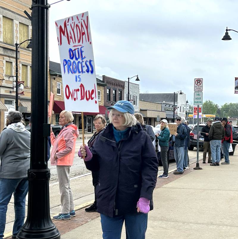 Attendees held signs at the Thursday, May 1, 2025, May Day Rally in Oregon.