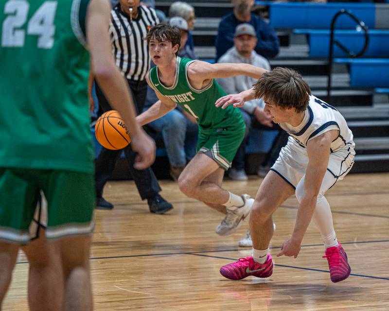 Joe Duffy (1) of Dwight dribbles ball past Braden Hahn (2) of Fieldcrest causing Hahn to trip over own foot on Monday, December 15, 2025 at Fieldcrest High School in Minonk.