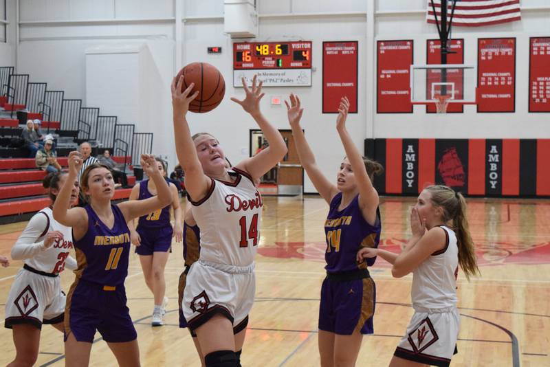 Hall's Ella Sterling pulls down a rebound in Friday's third-place game of the Amboy Holiday Tournament against Mendota. Hall won 62-31.