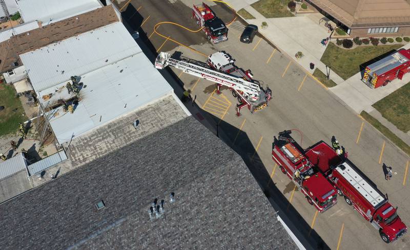 An aerial view of firefighters working the scene of a fire at Grassers Heating and Plumbing on Wednesday, Sept. 17, 2025 in McNabb. The fire began shortly before 10a.m. A Mutual Aid Box Alarm System (MABAS) was elevated to the fourth-alarm. No one was injured in the fire. Fire departments from McNabb, Peru, Utica, Henry, Ladd, Hennepin, Granville, Oglesby, Spring Valley, Leonore, Troy Grove, Seatonville, Wenona, Standard, Lacon-Sparland, Bureau and Tonica all responded to the scene. Firefighters left the scene at 11:30a.m.