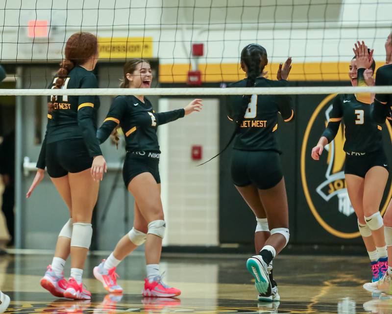 Joliet West celebrates a point during regional final volleyball match between Bolingbrook at Joliet West.  Oct 26, 2023.