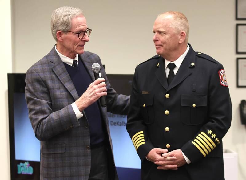 DeKalb City Manager Bill Nicklas introduces acting DeKalb Fire Chief Michael Thomas to be sworn in as the city's new full-time fire chief Monday, April 11, 2022, during the DeKalb City Council meeting at the library. Thomas has been serving as the acting chief since the retirement of former chief Jeff McMaster in November.