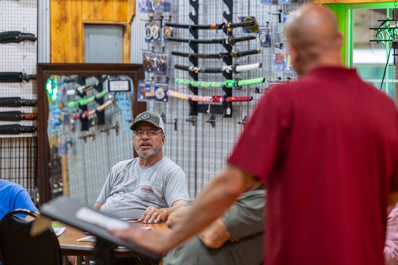 (from left) Bob Hurst asks question to John Bosch at 'Guns Save Life' event on Thursday, Aug 21, 2025 at Jamie's Outpost in Utica.