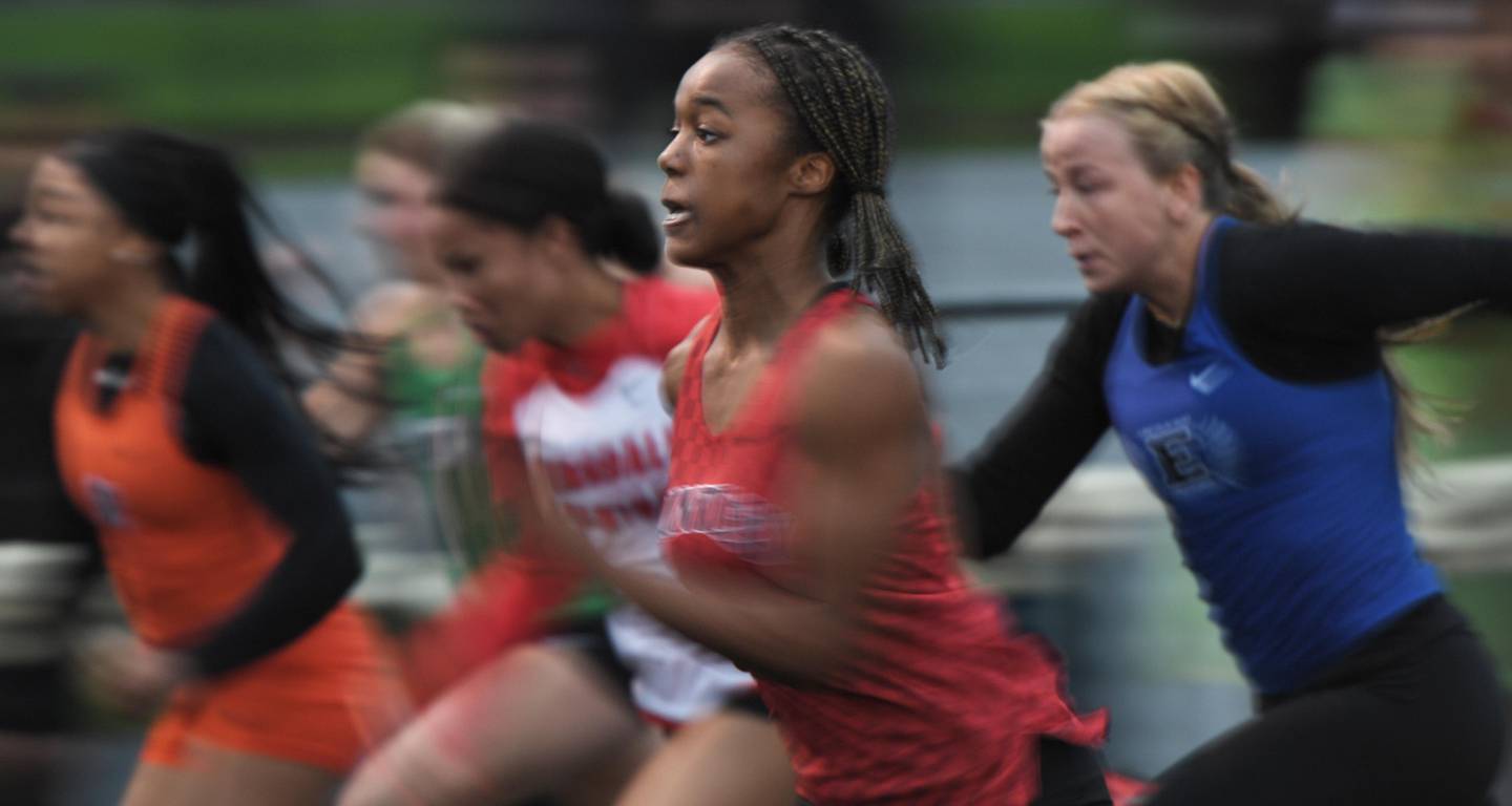 Huntley’s Alex Johnson at the start of the 100-meter dash at the Wheaton Warrenville South girls track invitational in Wheaton on Friday, April 29, 2022.