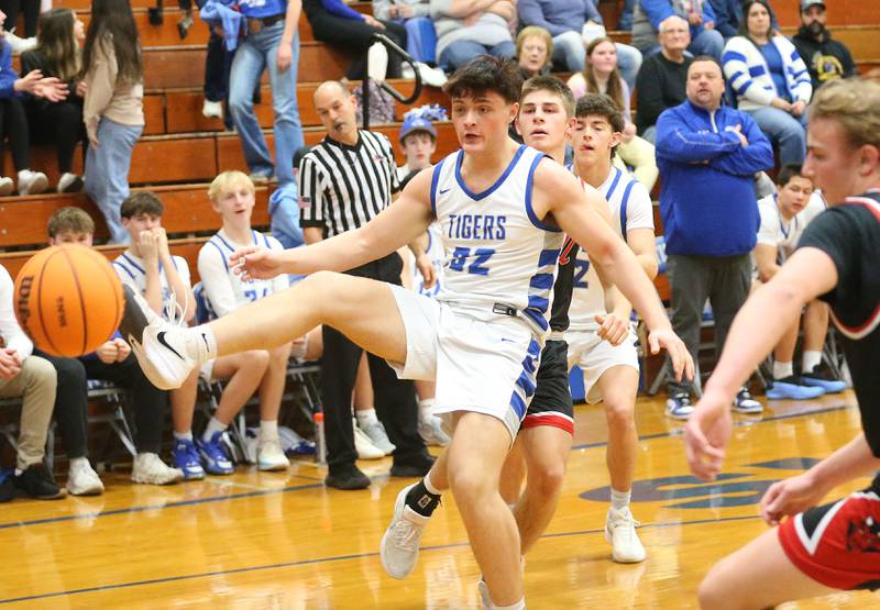 Princeton's Owen Hartman lifts his leg up to stop the ball against Hall on Friday, Feb. 13, 2026 at Princeton High School.