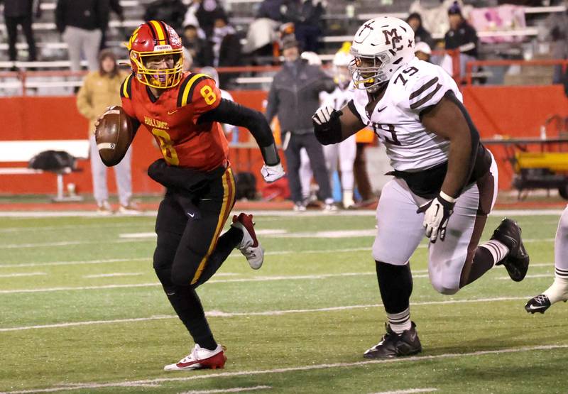 Batavia's Michael Vander Luitgaren runs away from the pressure of Mount Carmel's Caleb Tucker during their Class 7A state championship game Saturday, Nov. 30, 2024, in Hancock Stadium at Illinois State University in Normal.
