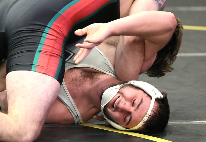 LaSalle-Peru’s Connor Lorden turns Rochelle’s Kaiden Morris during their 220 pound championship match Saturday Jan. 21, 2023, during the Interstate 8 Conference wrestling tournament at Sycamore High School.