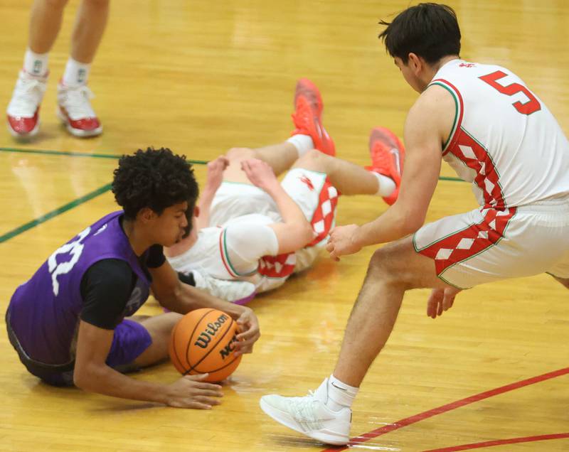 Dixon's Xavion Jones knocks the ball free as L-P's Erick Sotelo looks at the ball on Tuesday, Jan. 20, 2026 in Sellett Gymnasium at L-P High School.