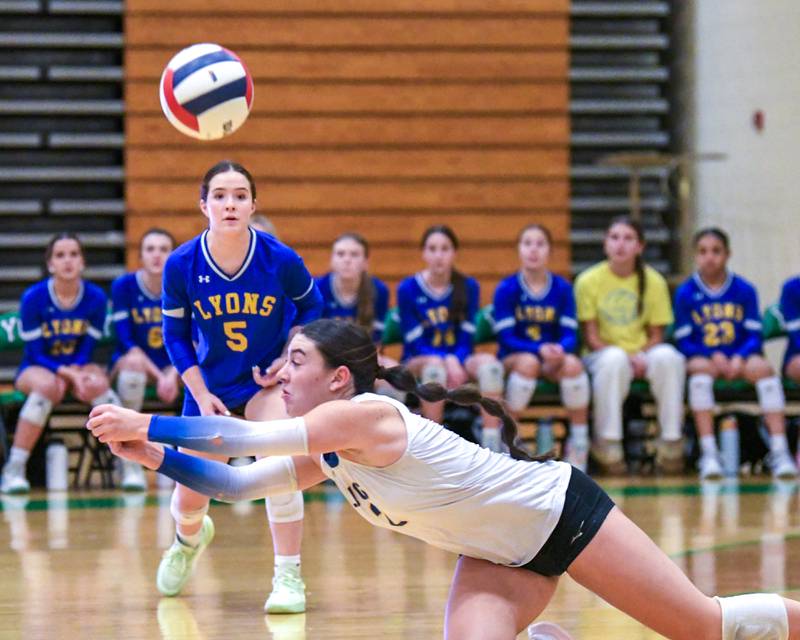 Lyons Township's Julia Ahrens (2) dives for the ball during the regional title game while taking on York on Thursday Oct. 30, 2025, held at York High School.