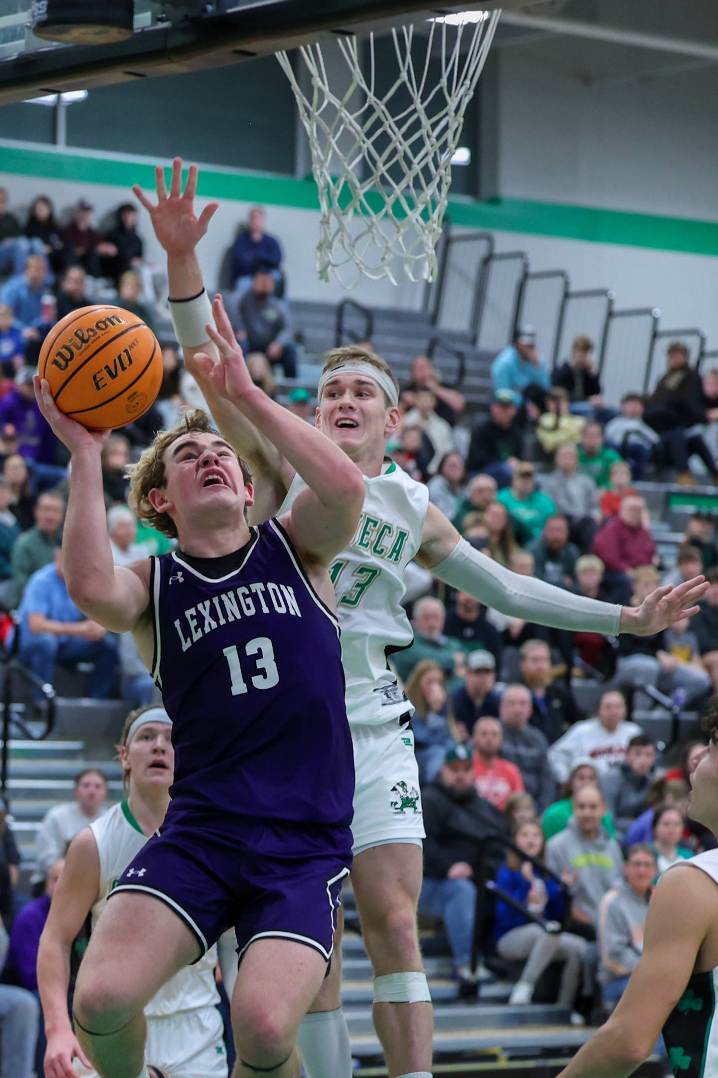 Seneca's Paxton Giertz contests a shot by Lexington's Joe Cheever in the championship game of the Shipyard Showdown Tournament this past season at Seneca High School.