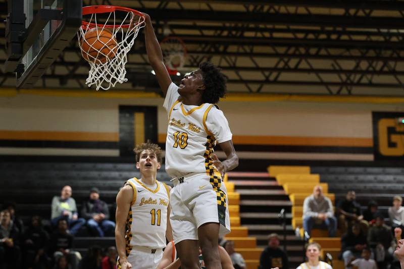 Joliet West’s Abrey Robinson throws down a dunk against Plainfield East on Friday, Dec. 19, 2025 in Joliet.