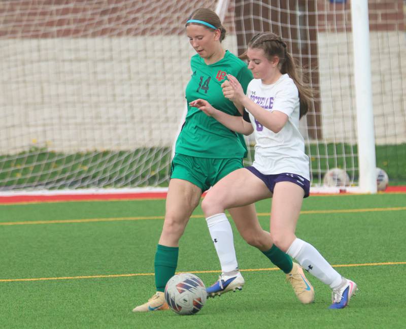 L-P's Rosalie Leininger and Rochelle's Paige Harris go after the ball on Wednesday, April 15, 2026 at the L-P Athletic Complex in La Salle.