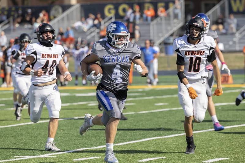 Newman’s Matthew Blackert picks up big yards against Kewanee Saturday, Oct. 18, 2025.