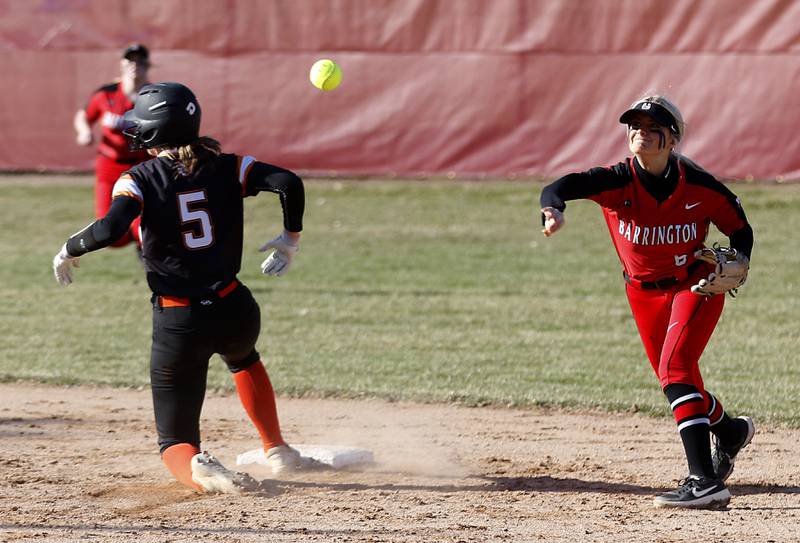 Barrington’s Nikki Vojack throws to first base to turn a double play as McHenry's Emma Stolzman reaches second base during a non-conference softball game Friday, April 1, 2022, between McHenry and Barrington at Barrington High School.
