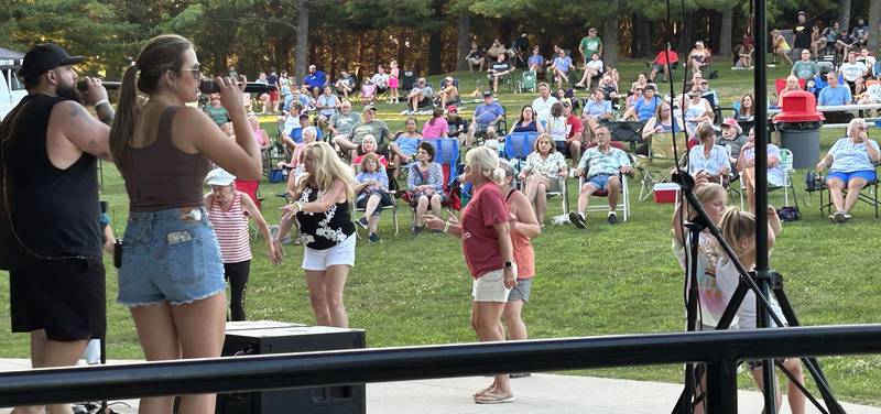 People dance to the music of Blue Steel at the Oregon Park District's Concert in the Park on Tuesday, July 15, 2025 at Oregon Park West. E.D. Etnyre Co. was the sponsor for the outdoor concert.