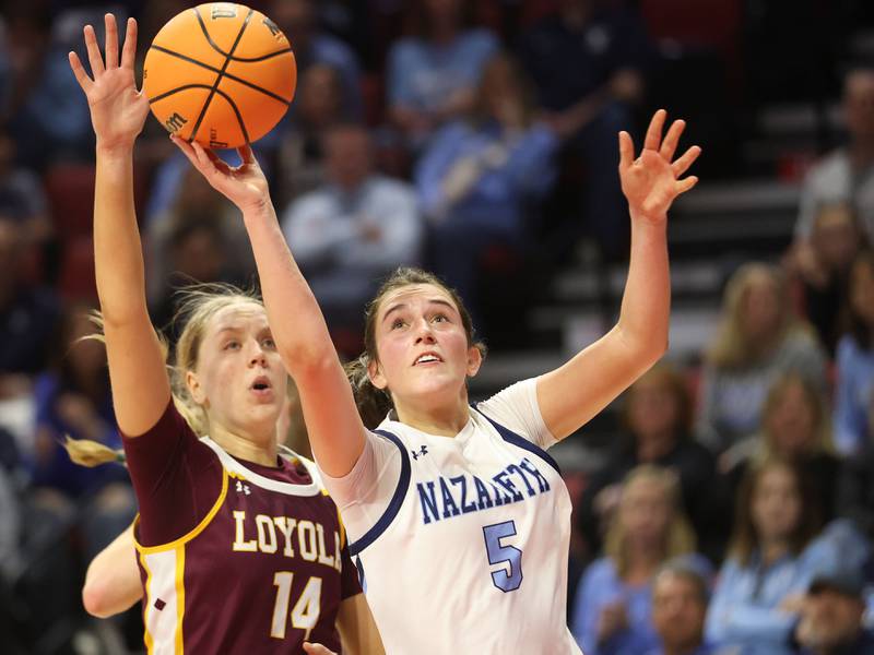 Nazareth's Sophia Towne scores on a layup over Loyola's Emily Naraky during the Class 4A State girls basketball championship game on Saturday, March 7, 2026 at CEFCU Arena in Normal.