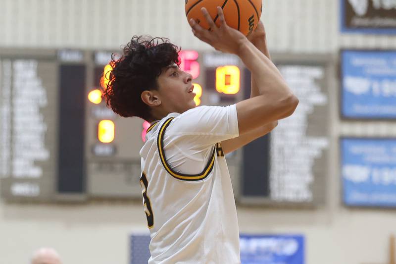Joliet Catholic’s Danny Cervantes takes the outside shot against Elmwood Park in the Class 3A Joliet Catholic Regional semifinal game on Wednesday, Feb. 25, 2026 in Joliet.