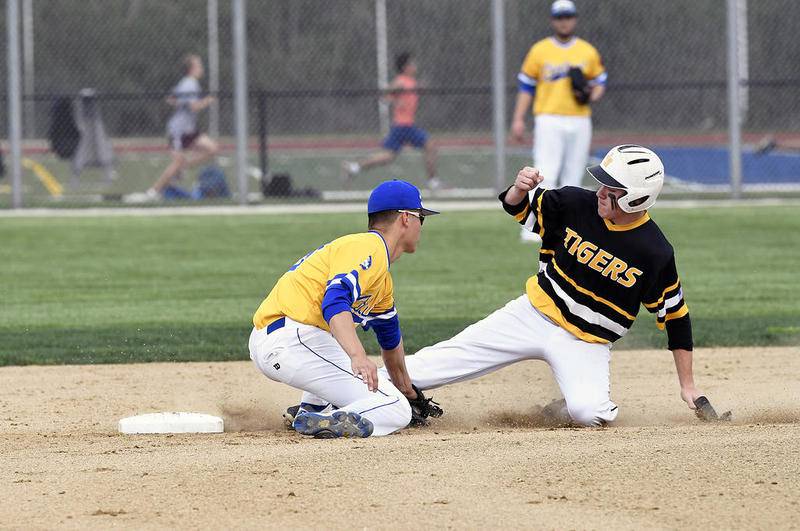Joliet Central's Nick Gutierrez tags out at Joliet West's Brett Johnson on a steal attempt in the first inning of the Steelmen's 3-2 victory.
