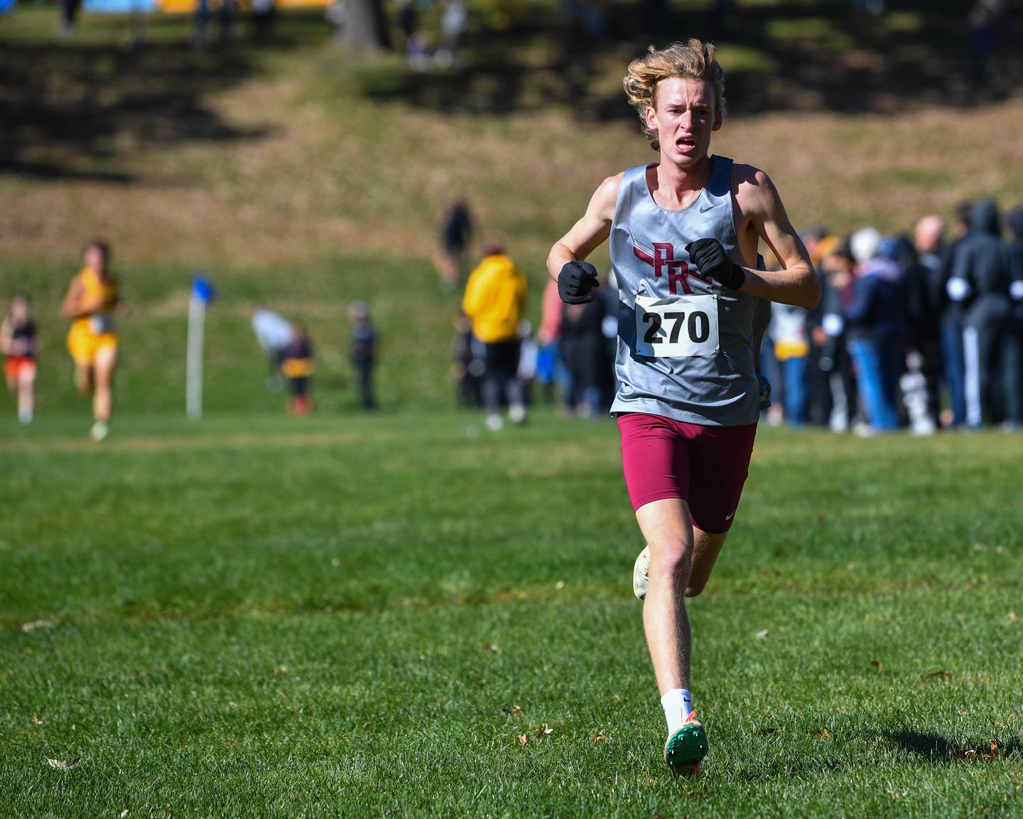 Prairie Ridge's Will Gelon heads for the finish line to finish third in the Fox Valley Conference boys cross country meet at Veteran Acres Park on Saturday, Oct. 15, 2022 in Crystal Lake.