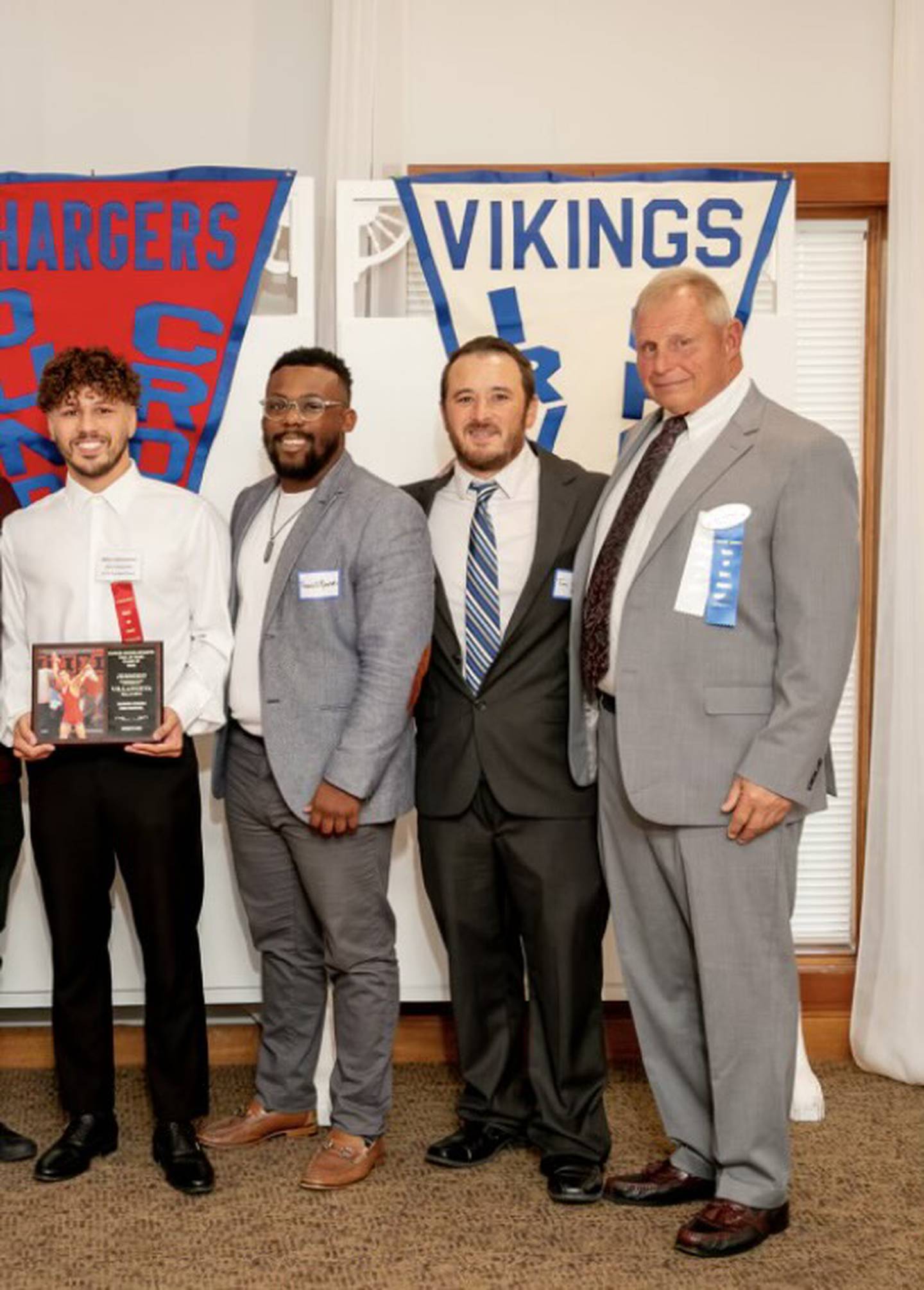 Former Dundee-Crown wrestler Miko Villanueva, assistant coach Travell Rounds, head coach Tim Hayes and former coach Al Zinke.