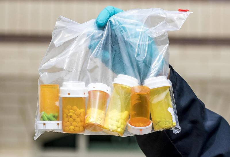 This file photo shows a bag of prescription drug dropped off at the Woodstock station Saturday during National Prescription Drug Take Back Day.